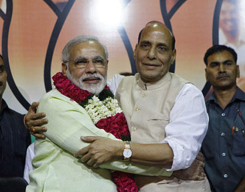 Narendra Modi (2nd L) hugs Rajnath Singh (2nd R), president main opposition Bharatiya Janata Party (BJP), after Modi was crowned as the prime ministerial candidate for the BJP at the party headquarters in New Delhi. REUTERS