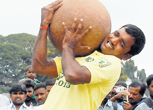 A youth takes part in rural sports organised as part of Raitha Dasara in Mysore on  Wednesday. KPN