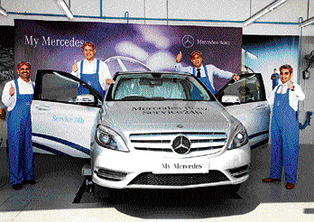 (From left) Devdutta Chandavarkar, Mercedes-Benz India Vice-President (Aftersales), Mercedes-Benz India MD&#8200;&&#8200;CEO Eberhard Kern, T&T Motors MD Vidur Talwar and T&T Motors Executive Director Rohan Talwar strike a pose with a Merc in tow.