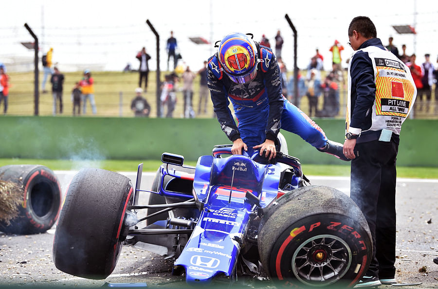 Alexander Albon climbs out of his crashed Toro Rosso car during final practice for the Chinese Grand Prix in Shanghai on Saturday. Picture credit: AFP