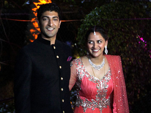 Hema Malini and Dharmendra's younger daughter Ahana Deol and Vaibhav Vora pose after their marriage in Mumbai on Sunday. PTI Photo