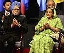 Prime Minister Manmohan Singh with Bangladesh's Prime Minister Sheikh Hasina at the Commonwealth Heads of Government meeting (CHOGM) in Port-of-Spain, Trinidad, on Friday. PTI