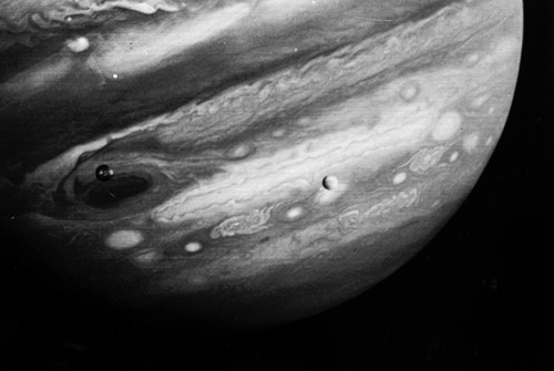This Feb. 13, 1979 photo released by NASA's Jet Propulsion Laboratory on Feb. 22, 1979 shows the planet Jupiter and two of its moons, Io, left, and Europa, center. The Voyager 1 spacecraft was about 12.4 million miles from Jupiter when the photo was made. NASA said Tuesday, March 4, 2014 it is making preparations to plan a robotic mission to Jupiter's watery moon Europa, a place where astronomers speculate there might be life. The space agency set aside $15 million in its 2015 budget proposal to start planning a mission to Europa. No details were released but NASA chief financial officer Elizabeth Robinson said Tuesday that it would be launched in the mid-2020s. AP