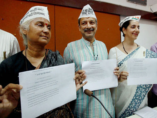 AAP candidates Mayank Gandhi ,Medha Patkar and Meera Sanyal releasing the party manifesto during a press conference in Mumbai on Thursday. PTI Photo