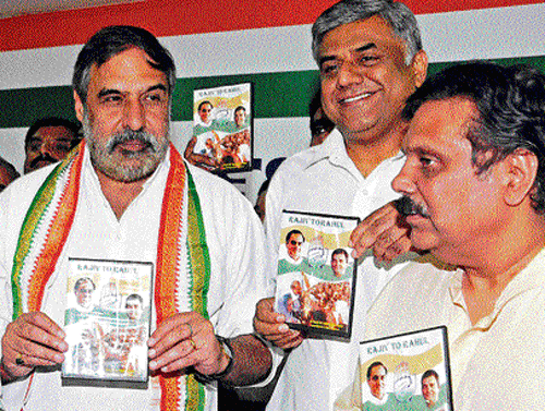 Union Minister Anand Sharma releases a DVD at a press  conference at the KPCC office in Bangalore on Thursday.  Raju Gowda and Niranjan Rao are also seen. dh Photo