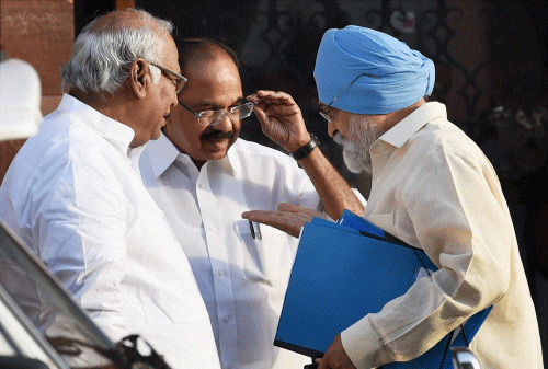 Union Ministers Mallikarjun Kharge, Veerappa Moily and Deputy Chairman of Planning Commission Montek Singh Ahluwalia after a cabinet meeting at PM's office in New Delhi on Tuesday. PTI Photo