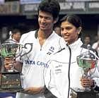 proud moment: Ajay Jayaram (left) and Trupti Murgunde with their Senior-ranking trophies in Bangalore on Saturday. dh photo