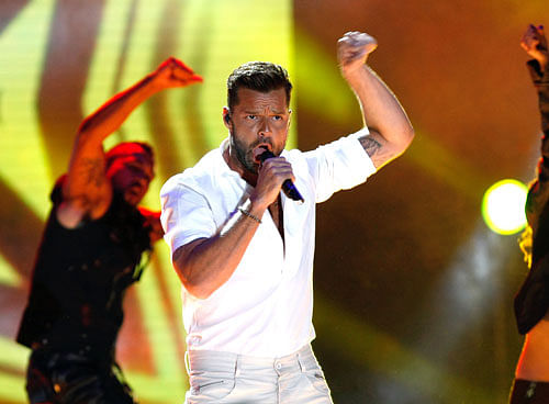 Singer Ricky Martin, father of five-year-old twins, does not find single parenting tough. AP File Photo.