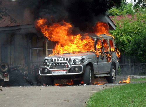 A vehicle goes up in flames after protestors demanding the creation of a separate Karbi Anglong state vandalized the residence of an official at Diphu, in Karbi Anglong district in northeastern Assam. AP