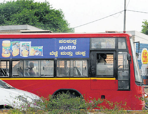 EXHAUSTING:  Passengers often miss their stop thanks to ads on the buses. dh photos by bh shivakumar