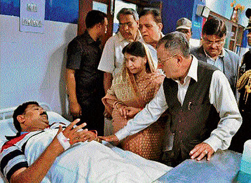 Chhattisgarh Governor Shekhar Dutt visits an injured victim of the poisonous gas leakage at Bhilai Steel Plant, at a hospital in Bhilai on Friday. PTI