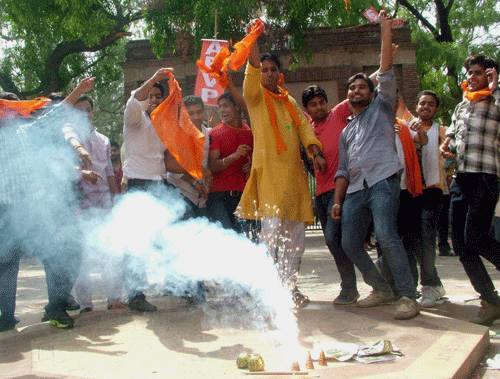 ABVP activists celebrate after the Delhi University (DU) finally scrapped the controversial four-year undergraduate programme (FYUP), at North Campus in New Delhi on Friday. PTI Photo
