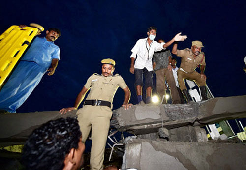 A 11-storeyed under-construction building collapsed in a city suburb today and several persons are feared trapped under the debris, a top Fire and Rescue Services official said.  PTI photo