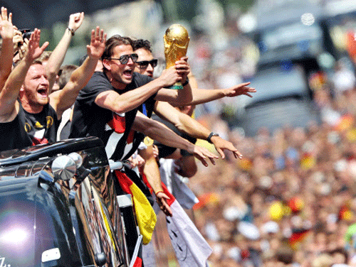 At a party 24 years in the making, hundreds of thousands of Germans showed their admiration and adoration for their World Cup winners in a victory parade to the Brandenburg Gate today.