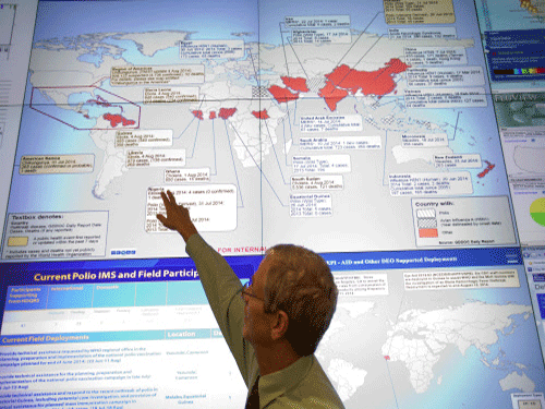 Steve Monroe, deputy director of the National Center for Emerging and Zoonotic Infectious Diseases at the U.S. Centers for Disease Control and Prevention, looks over a map showing global health issues under the agency's surveillance from their Emergency Operations Center. India today announced a grant of USD 50,000 each to some Ebola-affected countries, including Liberia, apart from putting in place various steps in the light of the outbreak of the virus in West African countries, including screening and tracking of passengers coming or transiting from there. AP photo