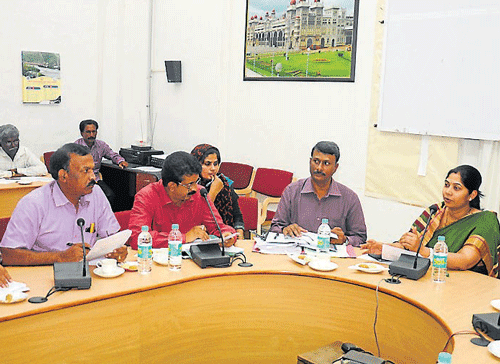 Deputy Commissioner C Shikha, Zilla Panchayat CEO P A Gopal and others during a meeting held at DCs office, in Mysore, on Monday.