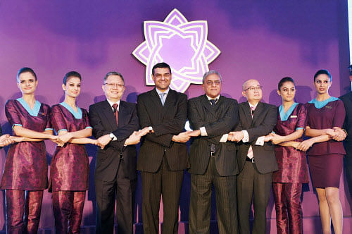 Prasad Menon (fourth from right), Chairman TSAL, Mukund Rajan (fifth from right), member Group Executive Council Director TSAL, Phee Teik Yeoh, CEO TSAL and Swee Wah Mak(third from left) Director and VP, Commercial SIA along with the air hostesses at the launch of Tata-SIA logo for their newly Christened Airline ''Vistara'' in New Delhi on Monday. PTI Photo