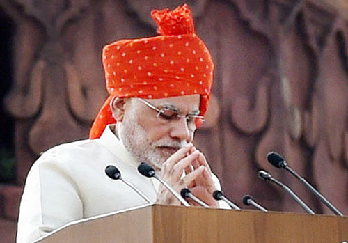 Prime Minister Narendra Modi gestures after addressing the nation during the 68th Independence Day function at the Red Fort in New Delhi on Friday. PTI Photo