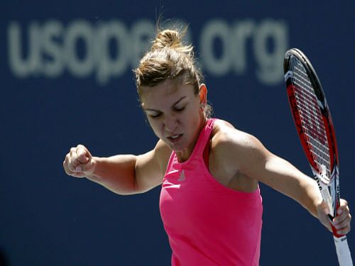 Simona Halep of Romania celebrates her win over Danielle Collins of the United States in the US Open first-round in New York on Monday.