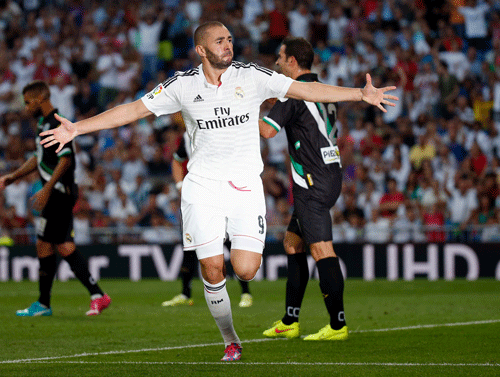 Real Madrids Karim Benzema celebrates after scoring a goal against Cordoba during their Spanish first division soccer match at Santiago Bernabeu stadium in Madrid August 25, 2014. REUTERS Photo