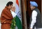 King of Bhutan, Jigme Khesar Namgyel Wangchuck (L) greets Indian Prime Minister Manmohan Singh at a meeting in New Delhi on  Tuesday. AFP