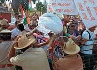 Police trying to stop the Congress members from entering Mescom office on Wednesday.