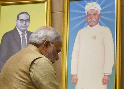 Prime Minister Narendra Modi paying tribute to dalit icon Ayyankali on his 152nd birth anniversary at a dalit conference in New Delhi on Monday. PTI Photo