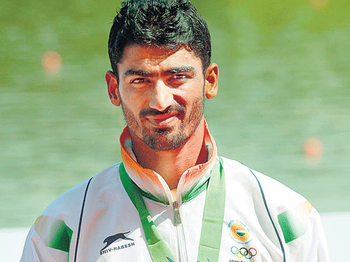brave effort: India's Sawarn Singh with his bronze in the men's single sculls event of Asian Games rowing on Thursday. PTI