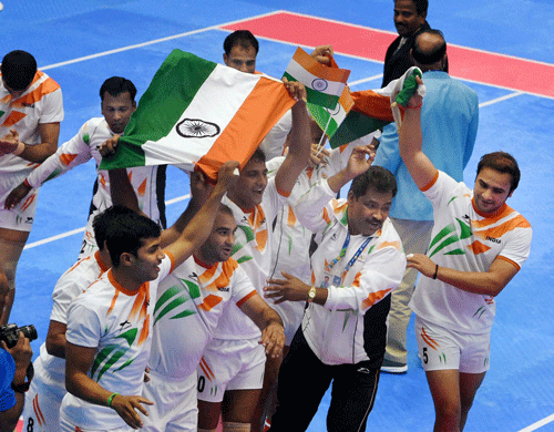 Indian men's Kabaddi team celebrate with Tricolours after winning gold at the 17th Asian Games in Incheon on Friday. PTI Photo