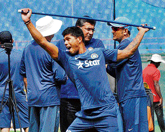 Paceman Umesh Yadav mixes some fun with his routine during India's practice session on Tuesday. PTI