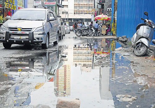 Dirty: Water stagnates for days on Church Street. dh photos by sk dinesh