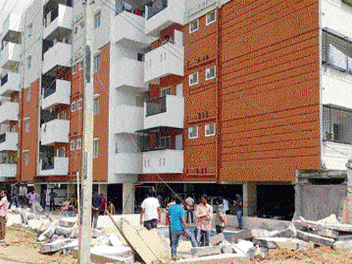 in focus: The apartment complex at Haralukunte village, that was taken over by the Bengaluru Urban district  administration on Saturday. dh Photo