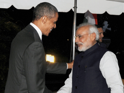 President Barack Obama has assured Prime Minister Narendra Modi that he will look into India's concerns on the H-1B visa issue as part of his comprehensive immigration reform, US officials said today.  AP File Photo.