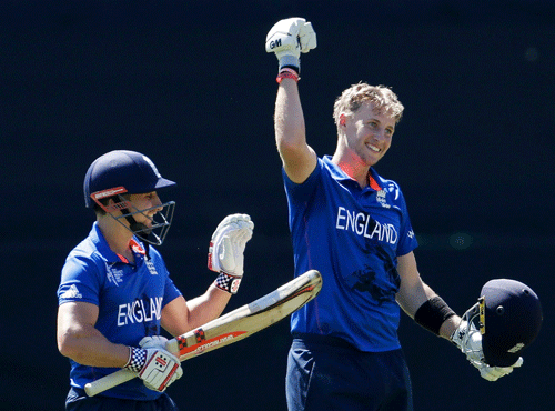 England's Taylor reacts next to team mate Root who celebrates reaching his century during their Cricket World Cup match against Sri Lanka in Wellington. Reuters photo