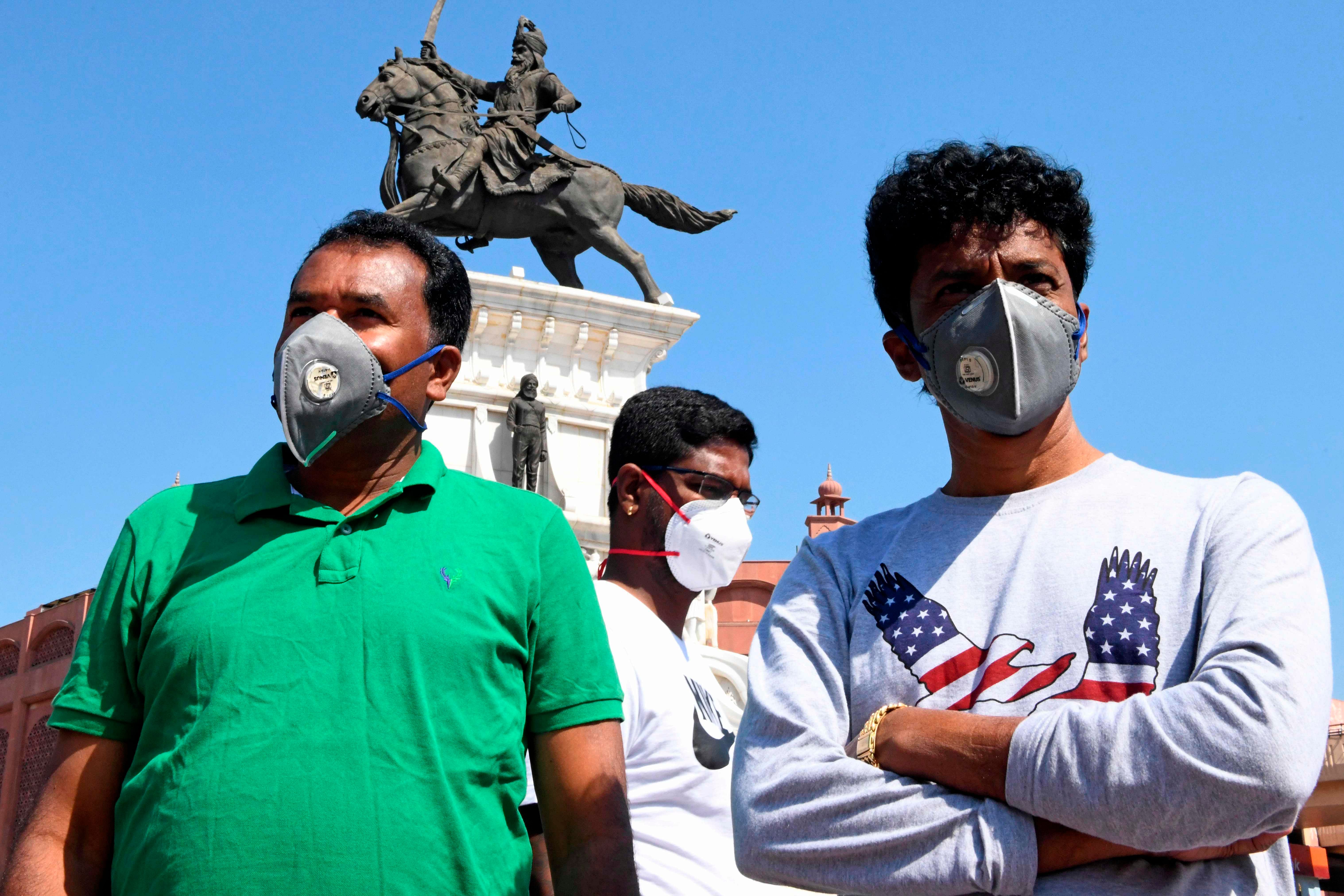 People wearing facemasks amid concerns over the spread of the COVID-19 novel coronavirus. (AFP Photo)