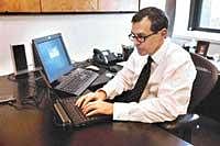 Edward Stroz in his office in New York. 'Fighting computer crime is a balance of technology and behavioral science,' says Stros, a former agent with the FBI. NYT