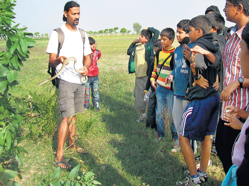 no more fear Herpetologist Gowri Shankar during a snake awareness  programme for school kids.