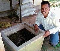 Farmer Rohith busy in preparing organic urea in Kodadinne village of Phalguni Gram Panchayat.  dh photo