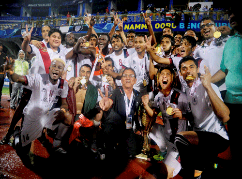 Mohun Bagan players celebrate after they drew with Bengaluru FC in the final game of the I-League season 2014-15 at the Kanteerva Stadium. PTI photo