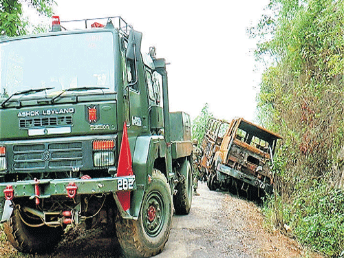 Army removes the ill-fated truck that was ambushed on June 4 on the Somtal road near Paraolon village of Chandel District of Manipur. PHOTO: DEEPAK OINAM