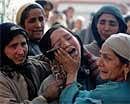 Kashmiris mourn Mushtaq Ahmed Mir during a protest over his killing in Shadi Marg some 55 kms (34 miles) south of Srinagar on Saturday. AFP