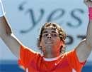 Rafael Nadal of Spain gestures to the crowd as he celebrates his victory over Ivo Karlovic of Croatia in their men's singles fourth round match of the Australian Open tennis tournament in Melbourne on Sunday. AFP
