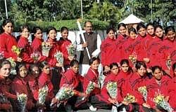 Madhya Pradesh chief minister Shivraj Singh Chouhan pose for a group photograph with Indian women hockey team after announcing Rs One crore financial assistance to the team, in Bhopal on Sunday. PTI