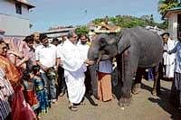 Dharmadhikari Veerendra Heggade with the elephant donated by Hospet MLA B S Anand Singh at Dharmasthala. dh photo