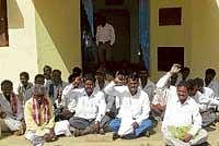 The villagers of Arooru and surrounding villages staging a protest in front of the Forest  Department office in Chikkaballapur on Monday alleging trespass by Forest officials into  their fields. dh photo