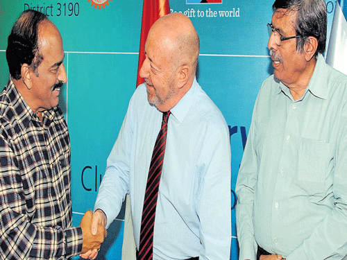 Chairman of Suchitra Cinema and Cultural Academy Ravindranath Tagore greets acting  Consul General of Israel Dov Segev Steinberg at a press meet on Israeli film festival on  Tuesday. President of Suchitra Film Society Shashidhara looks on. DH PHOTO