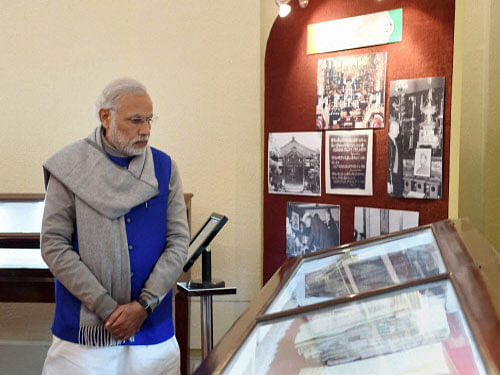 Prime Minister Narendra Modi going round the National Archives of India (NAI) where he released the digital copies of 100 declassified files related to Netaji Subhash Chandra Bose on his 119th birth anniversary, in New Delhi on Saturday. PTI Photo