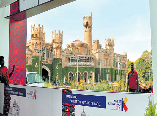 Workers erect stalls at the Bangalore Palace grounds for the Invest Karnataka 2016 meet, which begins on Wednesday. DH PHOTOS