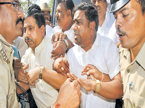 Police take BJP&#8200;State president Pralhad Joshi into custody  in Hubballi on Saturday. DH Photo