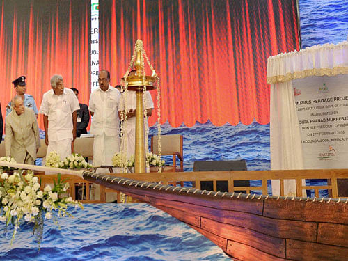 President Pranab Mukherjee inaugurating Muziris Project at Thrissur in Kerala on Saturday. Kerala Governor P Sathasivam and CM Oommen Chandy are also seen. PTI Photo.